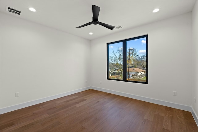 empty room with wood-type flooring and ceiling fan