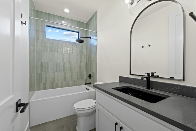 full bathroom with vanity, toilet, tiled shower / bath combo, and tile patterned flooring