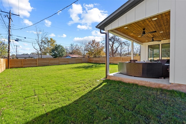 view of yard with a patio, an outdoor hangout area, and ceiling fan