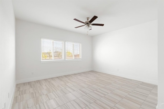 spare room with ceiling fan