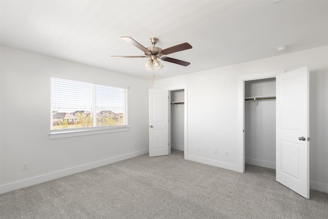 unfurnished bedroom with ceiling fan and carpet floors