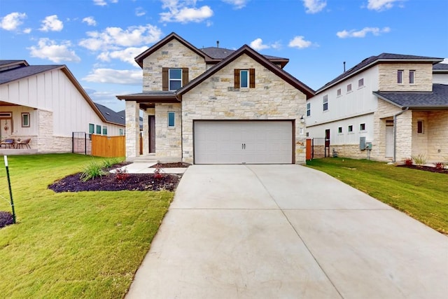 view of front of home with a front yard and a garage