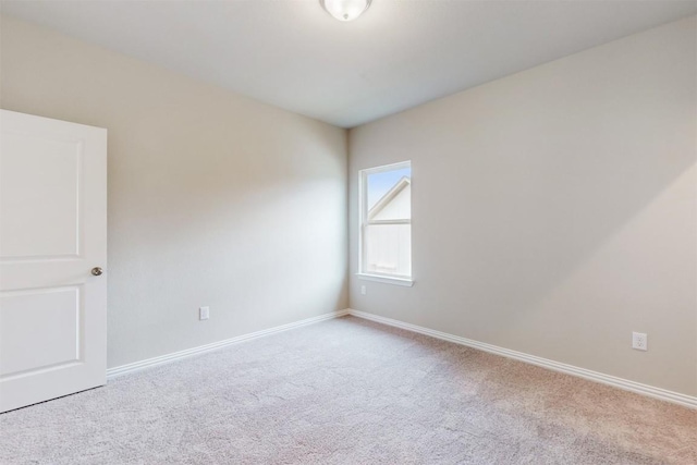 empty room with light colored carpet