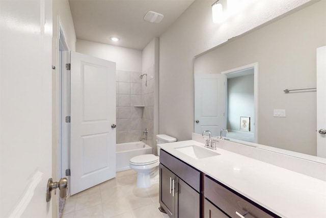 full bathroom with vanity, tiled shower / bath combo, tile patterned floors, and toilet