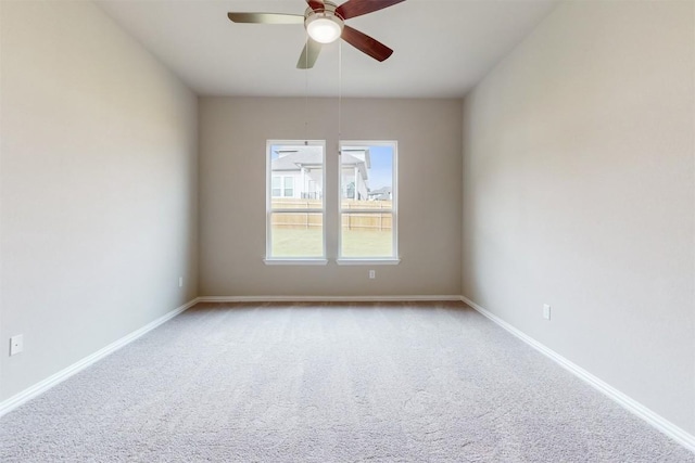 carpeted empty room with ceiling fan