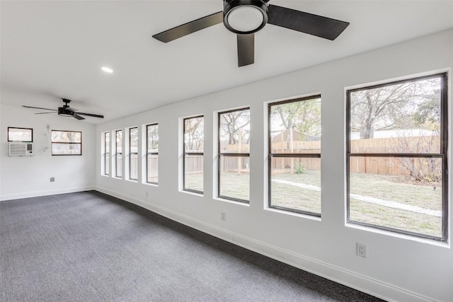 carpeted spare room with ceiling fan and cooling unit