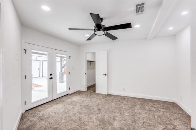 unfurnished bedroom featuring ceiling fan, french doors, carpet floors, access to outside, and a closet