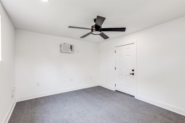 carpeted spare room with ceiling fan and a wall unit AC