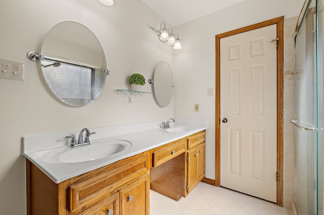 bathroom with tile patterned flooring and vanity