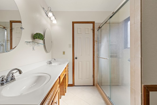 bathroom with vanity, tile patterned floors, and an enclosed shower