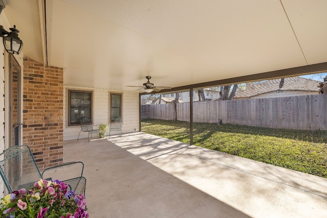 view of patio featuring ceiling fan