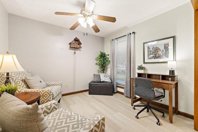 office featuring ceiling fan and light hardwood / wood-style flooring