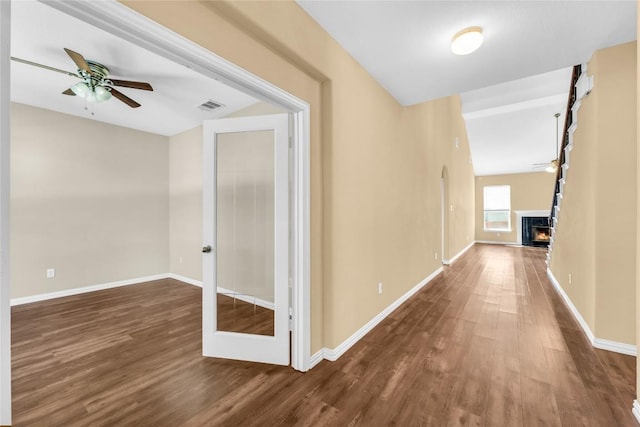 corridor with dark wood-type flooring