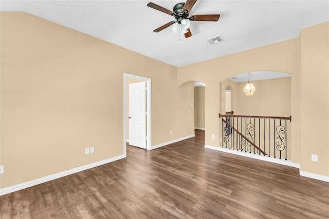 spare room with ceiling fan and dark wood-type flooring