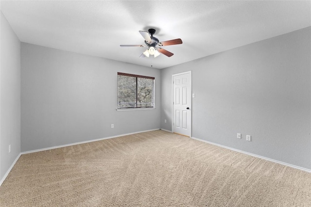 empty room featuring ceiling fan and carpet floors