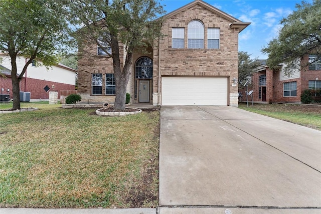 view of front of home with a garage and a front lawn