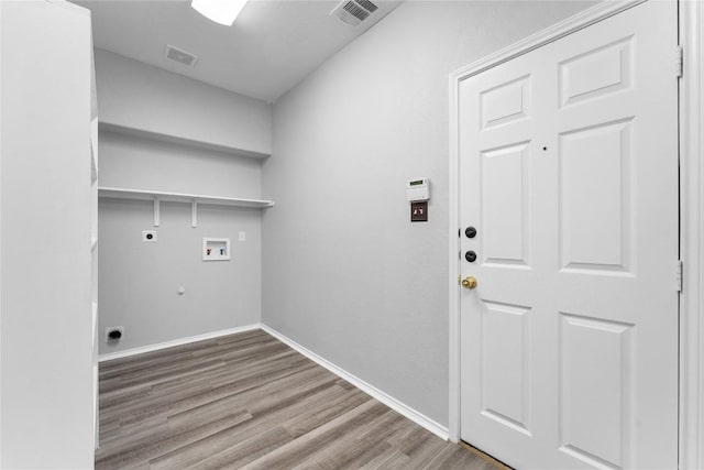 laundry area featuring hookup for a gas dryer, hardwood / wood-style floors, washer hookup, and hookup for an electric dryer