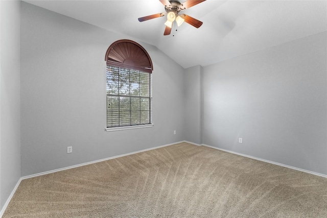 spare room with carpet flooring, ceiling fan, and lofted ceiling