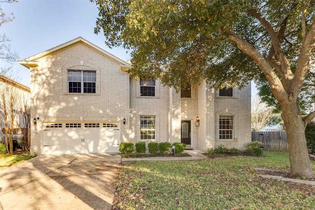 view of front of home with a garage and a front lawn