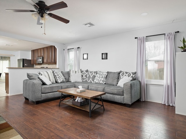 12400 Tay Ter, Austin, TX 78754 - living area with plenty of natural light, dark wood finished floors, and ceiling fan