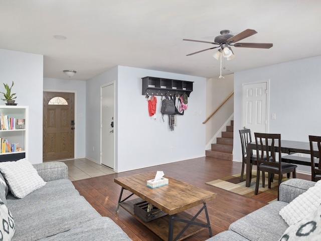 12400 Tay Ter, Austin, TX 78754 - living room with stairs, ceiling fan, wood finished floors, and baseboards