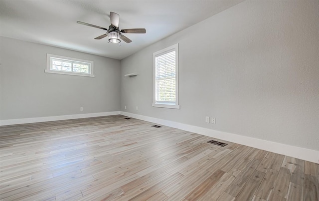 empty room featuring light hardwood / wood-style floors and ceiling fan