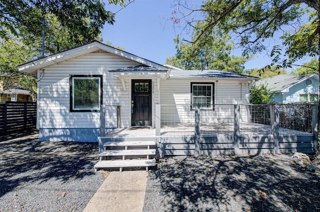 bungalow-style house featuring a wooden deck