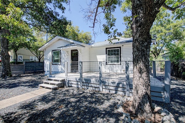 view of front of property with a wooden deck