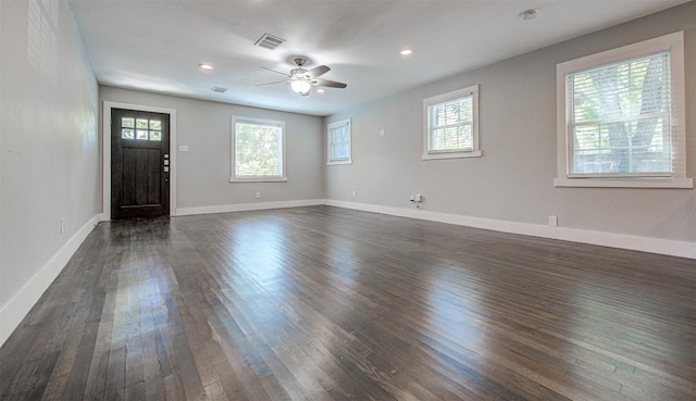 unfurnished room featuring dark hardwood / wood-style flooring and ceiling fan