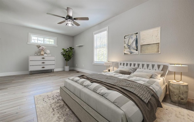 bedroom featuring light wood-type flooring and ceiling fan