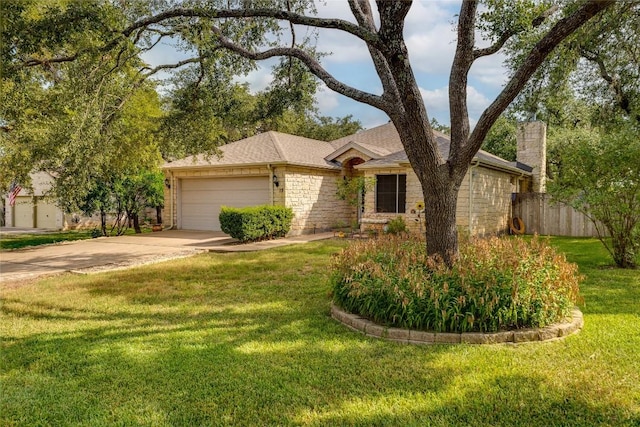 ranch-style house with a garage and a front yard