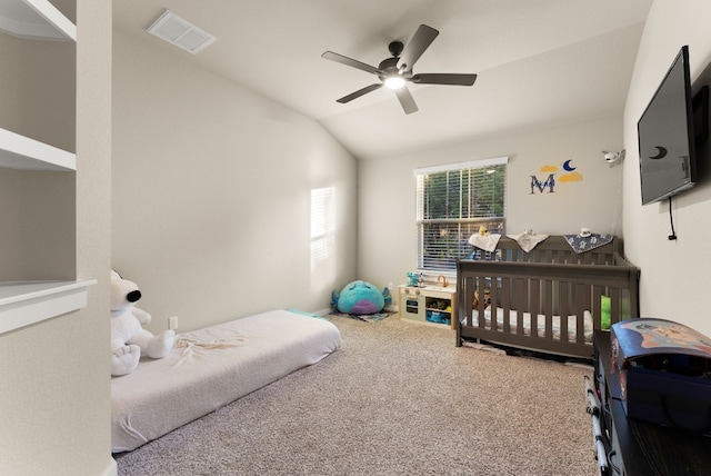 bedroom with ceiling fan, carpet, and vaulted ceiling