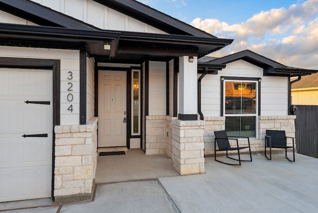 doorway to property featuring a garage