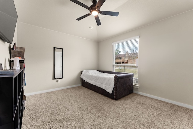 carpeted bedroom featuring ceiling fan and vaulted ceiling