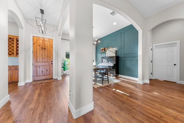 foyer featuring a chandelier and hardwood / wood-style flooring