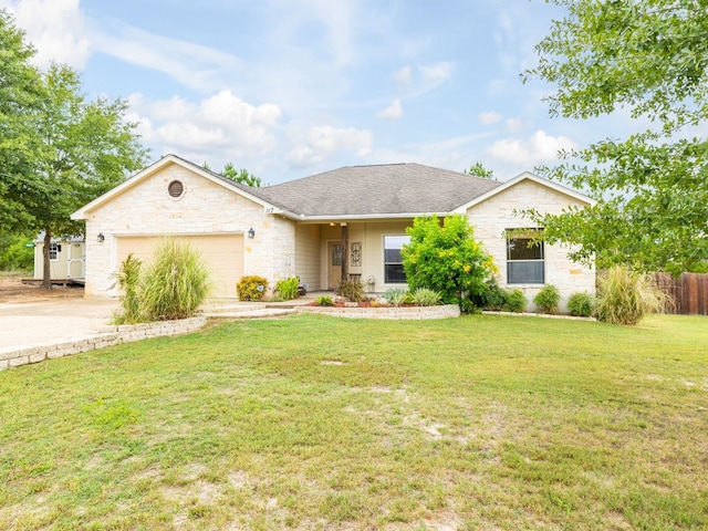 single story home featuring a garage and a front lawn