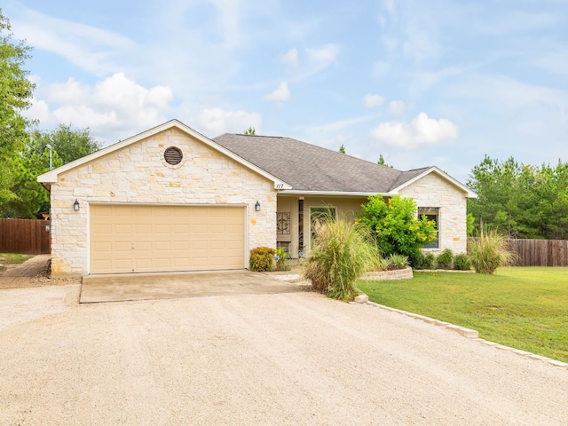 single story home featuring a front yard and a garage