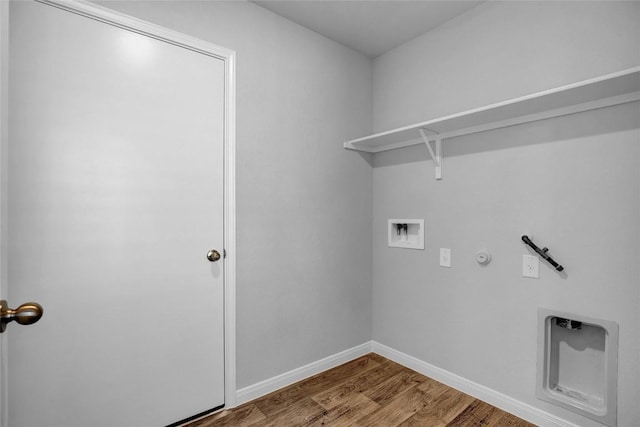 laundry area featuring wood-type flooring, hookup for a washing machine, and gas dryer hookup