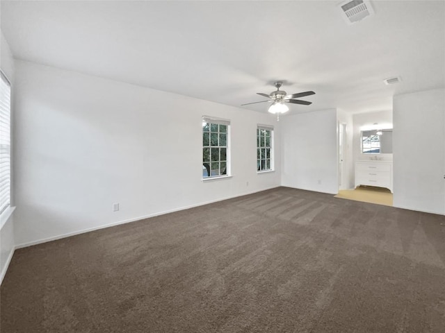 carpeted empty room featuring ceiling fan