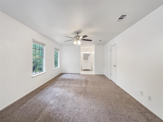 3424 Clarksburg Dr, Austin, TX 78745 - spare room featuring carpet flooring, a ceiling fan, and baseboards