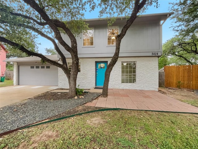 3424 Clarksburg Dr, Austin, TX 78745 - traditional-style home featuring driveway, a garage, and stone siding