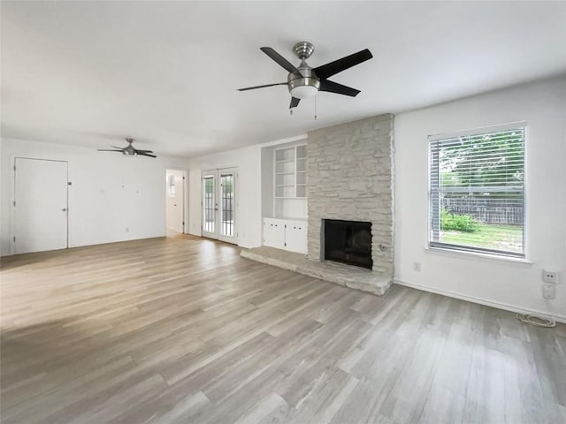3424 Clarksburg Dr, Austin, TX 78745 - unfurnished living room featuring a ceiling fan, plenty of natural light, and built in features