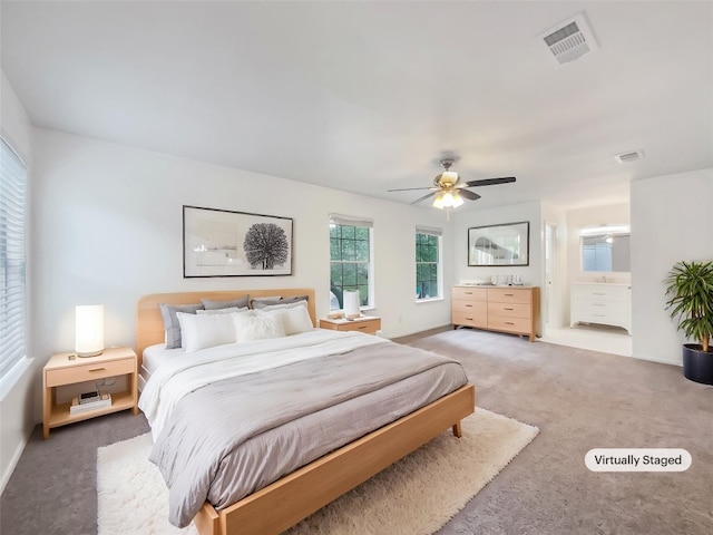 3424 Clarksburg Dr, Austin, TX 78745 - bedroom featuring light colored carpet, baseboards, a ceiling fan, and ensuite bath