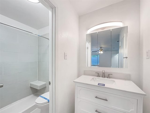 3424 Clarksburg Dr, Austin, TX 78745 - full bath with vanity, a tile shower, toilet, and a ceiling fan