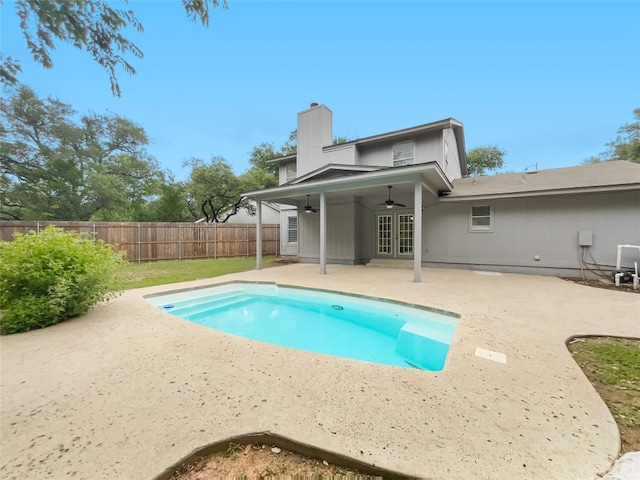 3424 Clarksburg Dr, Austin, TX 78745 - back of house featuring ceiling fan, a patio area, french doors, and a chimney
