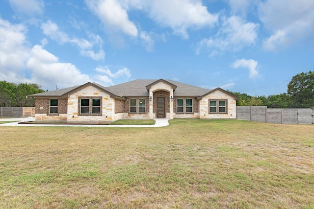 ranch-style house with a front lawn