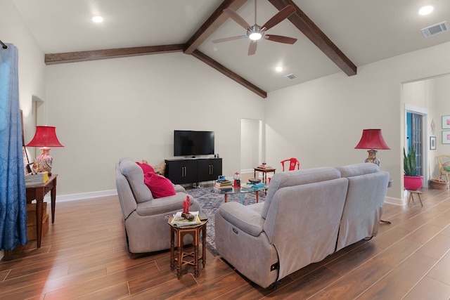 living room with ceiling fan and lofted ceiling with beams