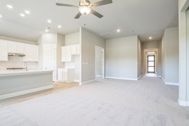 212 Millbend Rd, Georgetown, TX 78633 - unfurnished living room featuring ceiling fan, recessed lighting, and light colored carpet