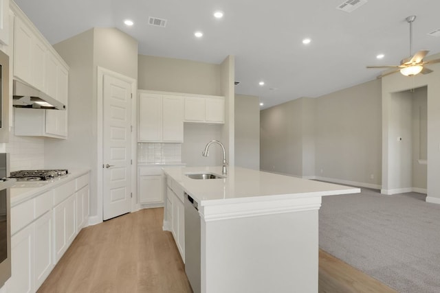kitchen featuring tasteful backsplash, visible vents, a sink, and appliances with stainless steel finishes