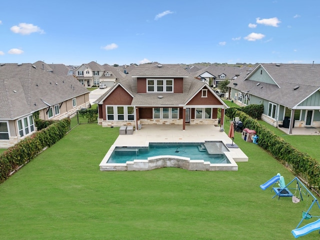 back of house featuring a patio area and a yard